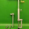 Handcrafted fly tying vise made of high-quality stainless steel, with an adjustable, hardened jaw designed for tying a variety of pike flies. Features a stable base for table attachment, multiple jaw positions, and can securely hold various hook sizes