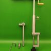 Precision-engineered stainless steel fly tying vise with adjustable jaws and a stable base, suitable for a wide range of hook sizes.