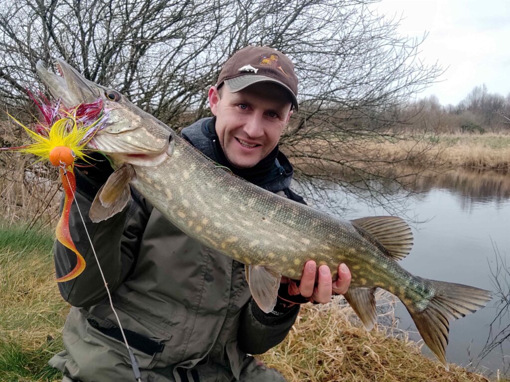 River landscape in winter with potential pike habitats highlighted, illustrating fishing spots for predatory fish