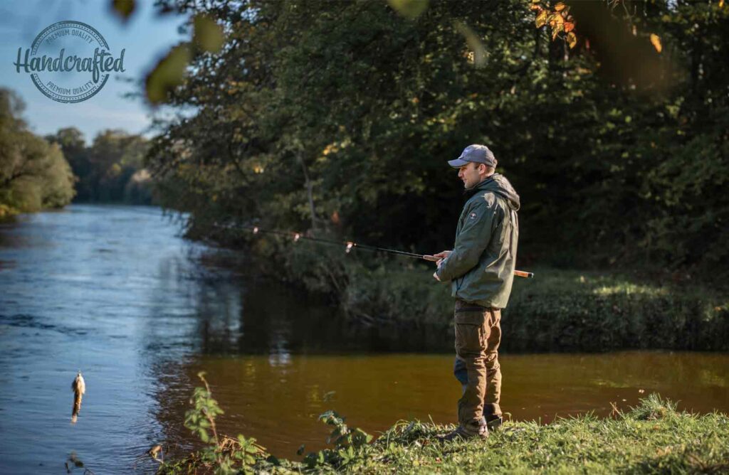 A sturdy, long fishing rod designed for shore-based pike fishing, equipped to handle heavy lures and big catches